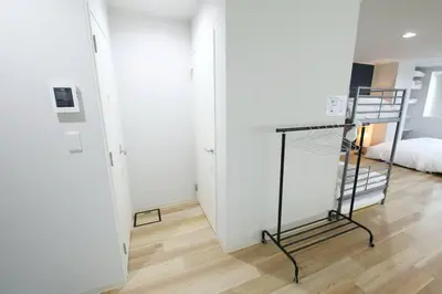 a room with a desk and a bed in a room at Hotel TORAKEN in Tokyo