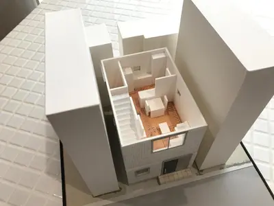 a model of a small house on a glass table at Honancho Entire house for rent \u6771\u4eac in Tokyo