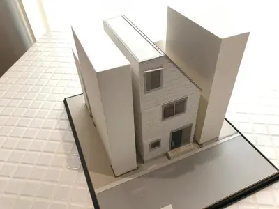 a model of a house on a glass table at Honancho Entire house for rent \u6771\u4eac in Tokyo