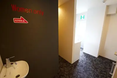 a bathroom with a sink and a sign that reads women only at Aikoku Building 5th floor - Vacation STAY 86252v in Tokyo