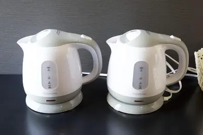 two white appliances sitting on top of a table at Aikoku Building 5th floor - Vacation STAY 86252v in Tokyo