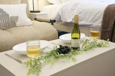 a table with a bottle of wine and glasses on it at \u30b3\u30fc\u30dd\u3071\u3071\u3069\u308c103 in Tokyo