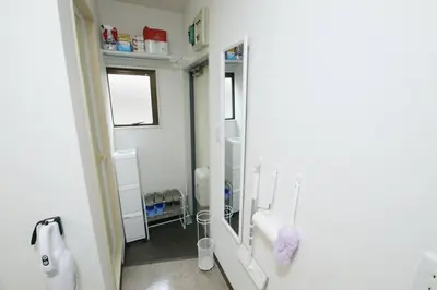 a bathroom with a mirror and a toilet in it at \u30b3\u30fc\u30dd\u3071\u3071\u3069\u308c103 in Tokyo