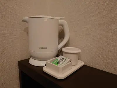a white blender sitting on top of a counter at Ochanomizu Inn in Tokyo