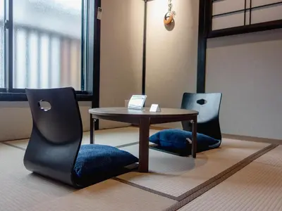 a table and chairs in a room with a table at Tokyo Nook in Tokyo