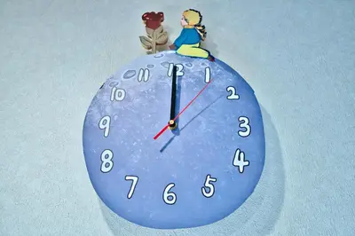 a clock with a figurine on top of it at Tokyo Nook in Tokyo