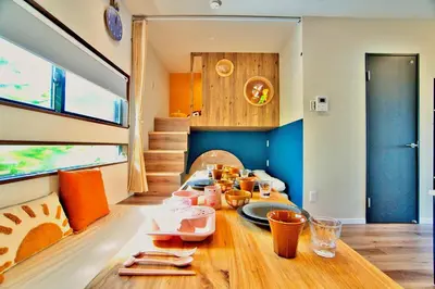 a dining room with a table with food on it at Tokyo Nook in Tokyo