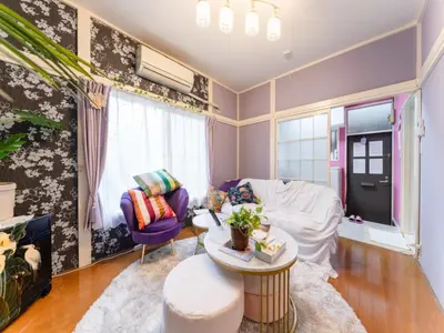 a living room with a couch and a table at Shinjuku, 3min walk from Nishi-Shinjuku 5-chome Sta, 3min Shinjuku Sta Switch, Wi-Fi ,Pocketwi-Fi in Tokyo