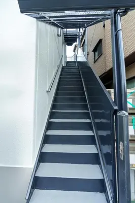 a staircase leading up to a building at \u9759\u5fc3\u5bbf Tranquil Retreat 2F in Tokyo
