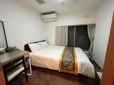 a small room with a bed and a desk and a bed sidx sidx at \u82b1\u4e43\u90f7 \u7530\u7aefab in Tokyo