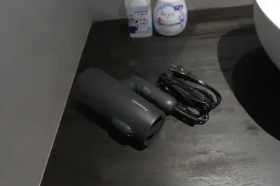 a couple of black cords sitting on a table at Rakuna Inn \u6674 Kinshi2 in Tokyo