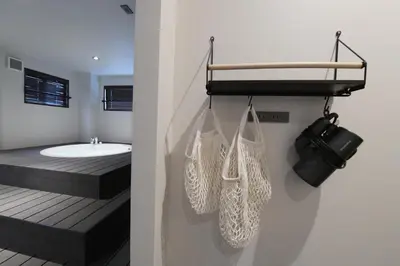 a bathroom with a sink and a bath tub at Rakuna Inn \u6674 Kinshi2 in Tokyo