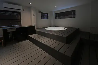a large bathroom with a tub and a sink at Rakuna Inn \u6674 Kinshi2 in Tokyo