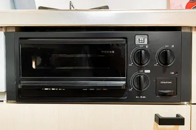 a microwave oven sitting on top of a counter at Sakura Suite in Tokyo