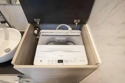 a washing machine in a drawer in a bathroom at CH RESiDENCE \u65e9\u7a32\u7530\u9db4\u5dfb\u753a in Tokyo