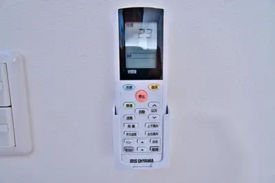 a cell phone is hanging on a wall at Tokyo Oasis Heiwajima in Tokyo