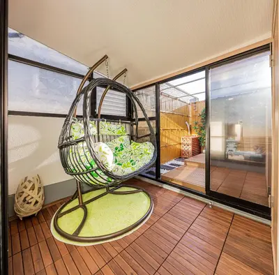 a swing on the balcony of a house at Family House \u857e \u6c60\u888b\u5f92\u6b65\u5708\u5168\u65b0\u88c5\u4fee\u65e5\u5f0f\u6237\u5efa\u6c11\u5bbf in Tokyo