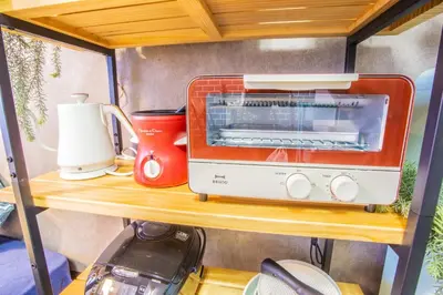 a toaster oven and a blender on a table at Fujiwa Excel Dogenzaka 602 - Vacation STAY 17792 in Tokyo
