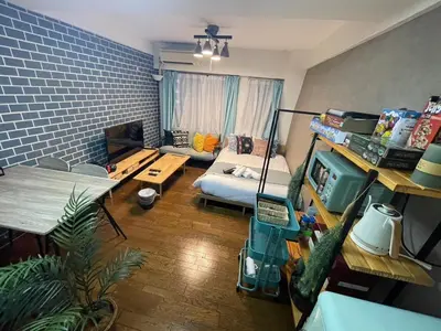 a living room with a couch and a bed in it at Fujiwa Excel Dogenzaka 602 - Vacation STAY 17792 in Tokyo