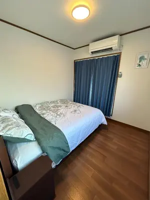 a bedroom with a bed and a window with a air conditioner at scented tea - Vacation STAY 21610v in Tokyo