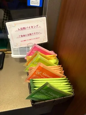 a pile of different colored envelopes on a table at Hotel SUNROAD Adult Only in Tokyo