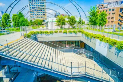 a building with a walkway with plants on it at Hotel SUNROAD Adult Only in Tokyo