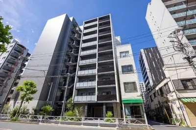 a tall building in the middle of some buildings at MAT Ryogoku in Tokyo