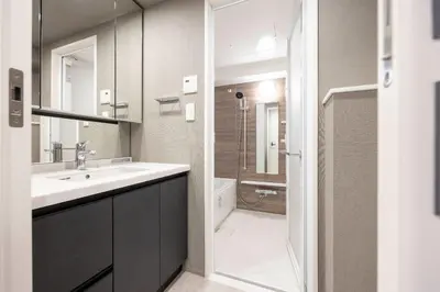 a bathroom with a sink and a shower at MAT Ryogoku in Tokyo