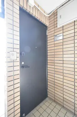 a large door in a room with a wall at Solana Roppongi in Tokyo