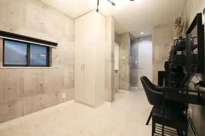 a room with a hallway with a window and a chair at AirHOME TOKYO EBISU101 in Tokyo
