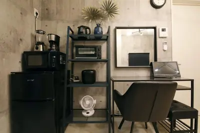 a room with a desk with a laptop and a chair at AirHOME TOKYO EBISU101 in Tokyo