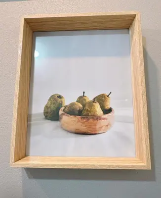 a framed picture of a bowl of pears at \u6771\u4eac\u30b9\u30ab\u30a4\u30c4\u30ea\u30fc\u30cf\u30a6\u30b9JoY in Tokyo