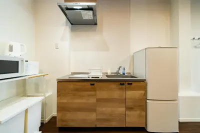 a kitchen with a sink and a refrigerator at 98, Higashi-tateishi A 1st floor of the apartment, \u6771\u7acb\u77f3A 1F in Tokyo
