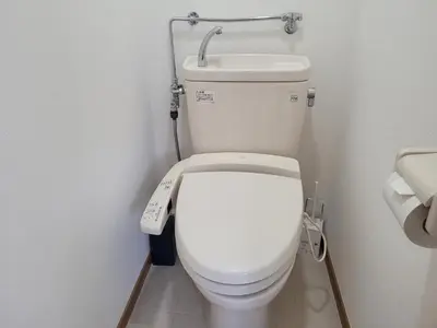 a bathroom with a white toilet with a remote control at Liberty Shinjuku House in Tokyo