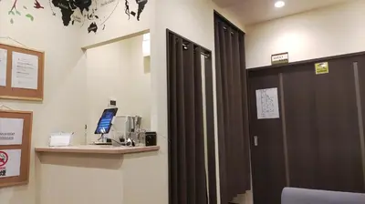an office with a door and a desk with a computer at \u65e5\u672c\u30ef\u30a4\u30f3\u30d0\u30c3\u30af\u30d1\u30c3\u30ab\u30fc\u30ba in Tokyo