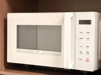 a white microwave oven sitting on top of a shelf at EV-Akabane House-KI0414 in Tokyo