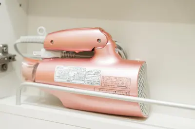 a pink appliance sitting on top of a shelf at Shinjuku luxury Apart ment 2 minutes from Higashi-Shinjuku in Tokyo