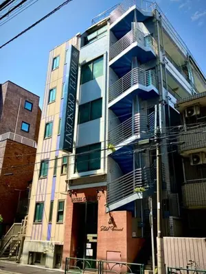 a building with blue balconies on the side of it at Business Hotel Crescent - Vacation STAY 49950v in Tokyo