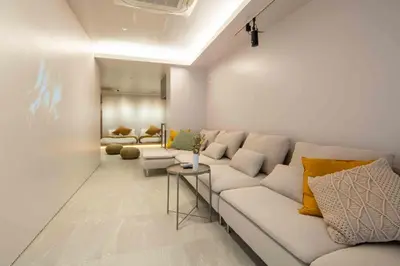 a living room with a couch and two couches at Sunny Heights 101 - Vacation STAY 27017v in Tokyo
