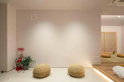 a living room with two stools on the floor at Sunny Heights 101 - Vacation STAY 27017v in Tokyo