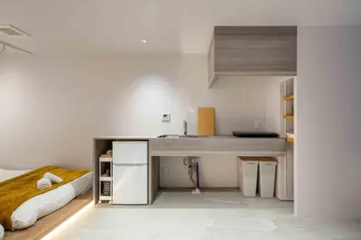 a kitchen with a desk and a bed in a room at Sunny Heights 101 - Vacation STAY 27017v in Tokyo