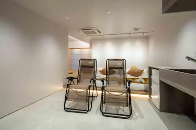 two chairs in a room with a kitchen at Sunny Heights 101 - Vacation STAY 27017v in Tokyo