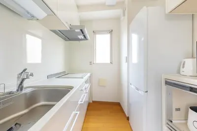 a kitchen with a sink and a microwave at ISI Building, 6th Floor - Vacation STAY 27331v in Tokyo