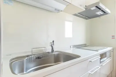 a stainless steel sink in a white kitchen at ISI Building, 6th Floor - Vacation STAY 27331v in Tokyo