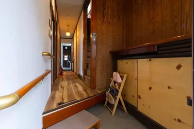 a hallway of a house with a wooden floor at \u4e00\u68df\u8cb8\u3057\u5e83\u3005115\u5e73\u7c73 \u8cb4\u9802\u5e9c\u90b8 \u5927\u8c37\u7530 KICYO HOUSE No1 in Tokyo