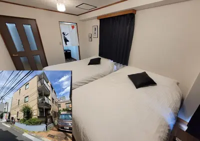 a hotel room with two beds and a window at Ema eve HOUSE in Tokyo