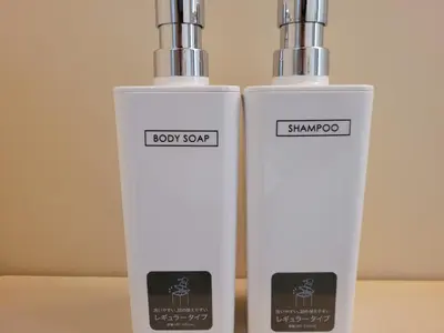 two white bottles sitting next to each other at Ema eve HOUSE in Tokyo