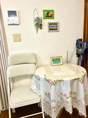 a table and a chair in a room at Sakura Bloom Separate House in Tokyo