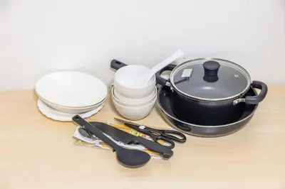 a table with a frying pan and other kitchen utensils at residencematsubara in Tokyo