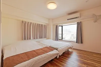 a bedroom with a bed and a large window at V Close to Shinjuku Kabukicho Korean Town FrWIFI F in Tokyo
